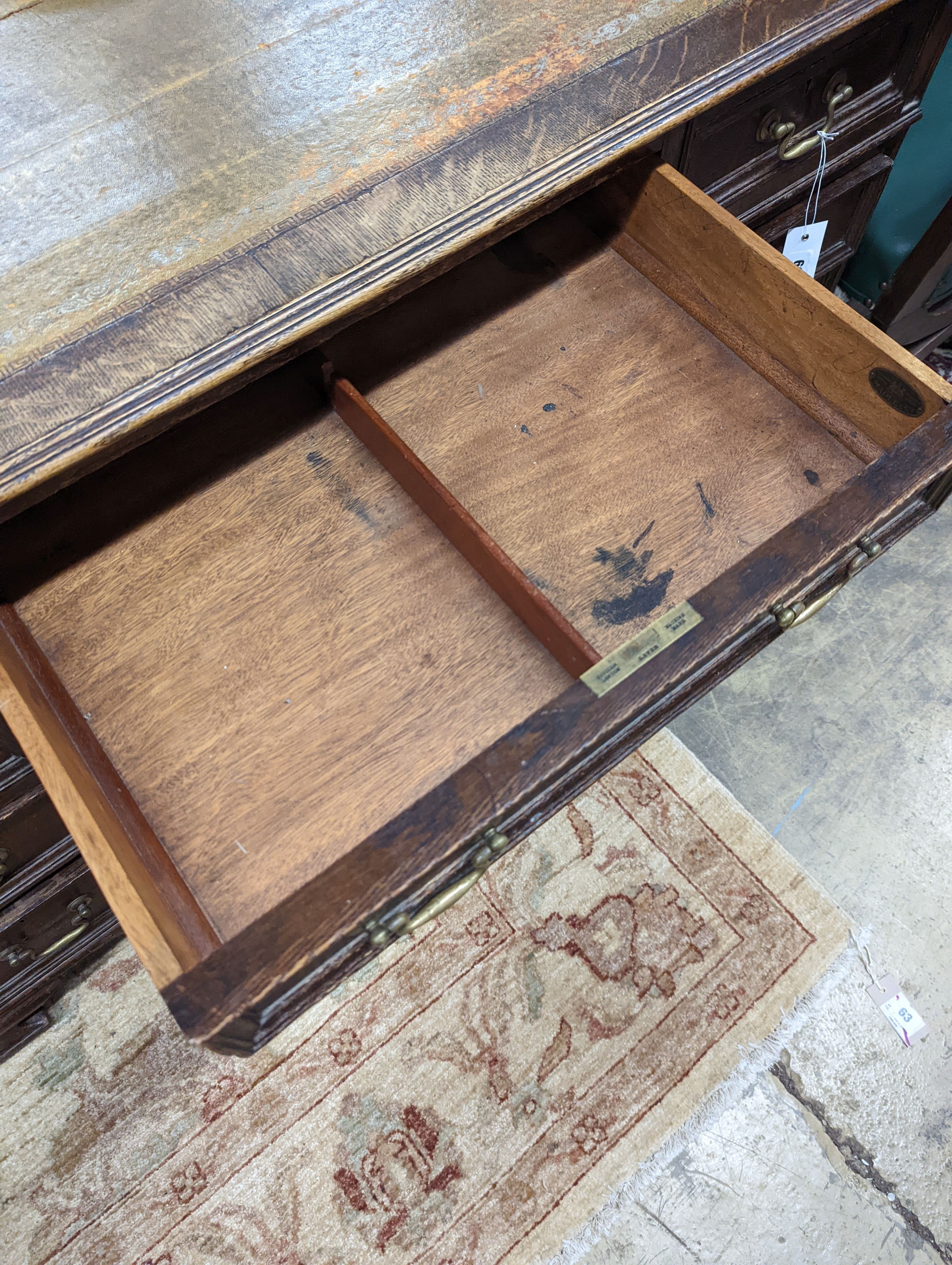 An early 20th century oak kneehole desk, length 122cm, depth 66cm, height 75cm